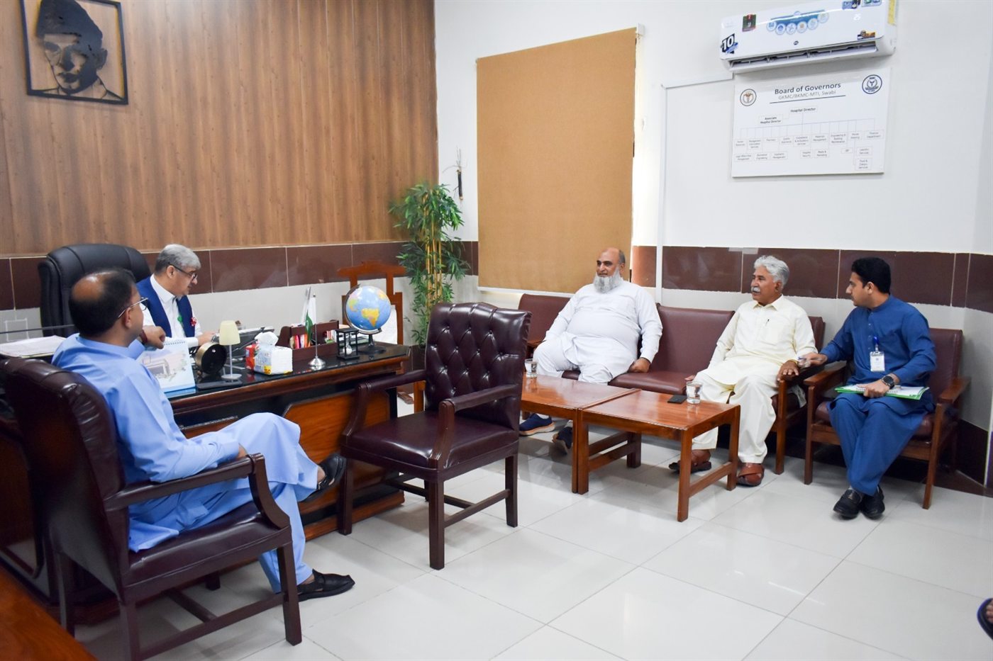 LEO representatives meeting senior hospital officials in an office at the Medical Teaching Institution in Swabi